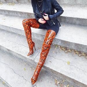 Thigh high snake skin boots